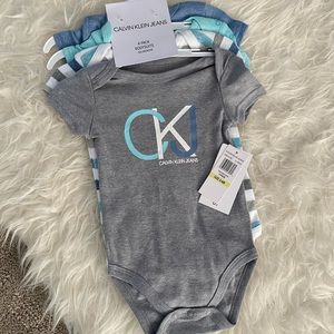 Calvin Klein Jeans 4 piece short sleeve bodysuits